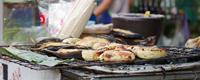 Bananas on the barbecue are a delicious snack in Cambodia